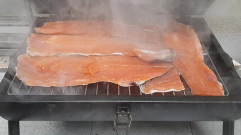 smoked salmon trout fillets in barbecue