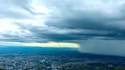 Time Lapse video 4k. Dark dramatic sky with heavy rain over Chiang mai city, Thailand.