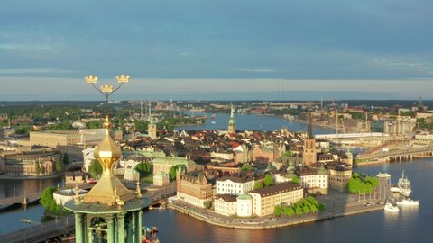 Drone shot Stockholm City Hall Old Town Gamla Stan aerial view. Summer evening in on of the most beautiful cities in the world. Cityhall from above in Sweden