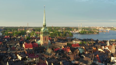 Stockholm Old Town Gamla Stan drone shot on summer evening. Rooftops and old buildings in different colors yellow orange red. Most beautiful city centers in Europe and worldwide