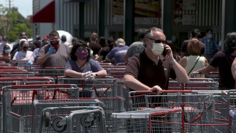 Los Angeles, CA/USA.Circa 05/2020.   people waiting in a line for shopping at supermarket in LA during Covid-19 coronavirus pandemic.