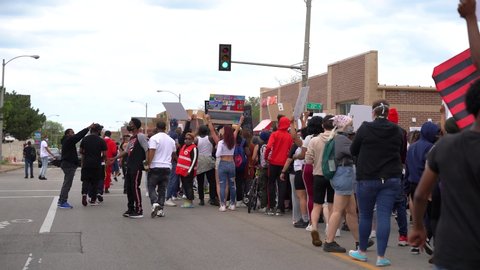 Appleton, Wisconsin / USA - May 30th, 2020: Midwest black lives matter coalition protesting in the streets and chanting black lives matter due to police brutality in the United States of America. 