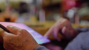 Father's day Senior elder 80s man using digital tablet computer pad modern tech relax on sofa. Retired old grandfather browse internet read e book in app chatting online with distance doctor at home. - Powered by Shutterstock - Get 15% off with code: PIKWIZARD15