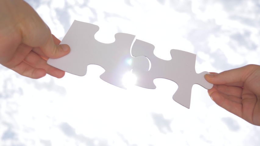 Two pieces of puzzle are interconnected. Problem solution concept. Relationships concept. Successful negotiations. Communication concept Social psychology of close relationships. Problem solving skill | Shutterstock HD Video #1054110800