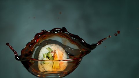 Super Slow motion Shot of Fresh Sushi Falling Into Soy Sauce at 1000fps.