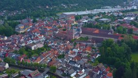 Aeriel view of the city Amorbach in Germany on a cloudy day in spring.