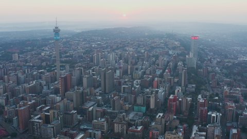 AFRICA,SOUTH AFRICA,CIRCA 2020.Aerial view of smog and pollution hanging over the Johannesburg City Centre at sunrise