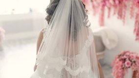 Beautiful bride is spinning in a wedding dress. The bride in her wedding dress is spinning in the room