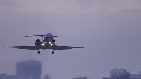 Business jet (private jet) taking off at dusk