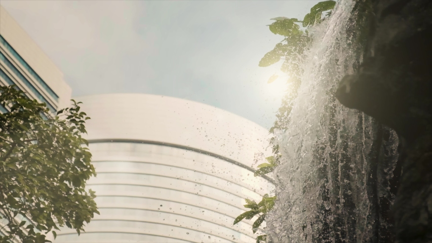 Falling Water with sun flare in Slow Motion at Hong Kong Park
