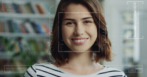 Close up of face of young beautiful woman with identification of biometric. Facial recognition of girl. Female scanning of face features. Futuristic 3D identificating. Portrait in library.