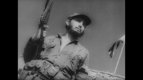 CIRCA 1959 - Fidel Castro and his guerrilla forces approach the National Capitol Building of Havana after successfully toppling the Batista regime.
