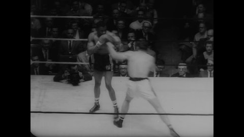 CIRCA 1958 - Heavyweight Dan Hodge defeats Charley Hood in a Golden Gloves champion boxing match held at Madison Square Garden.