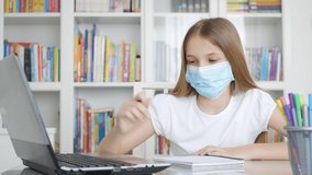 Kid Using Laptop Studying in Video Conferencing, Child Learning, Writing in Library, Schoolgirl Chatting with Teacher at Home in Coronavirus Pandemic Crisis, Homeschooling, Online Education