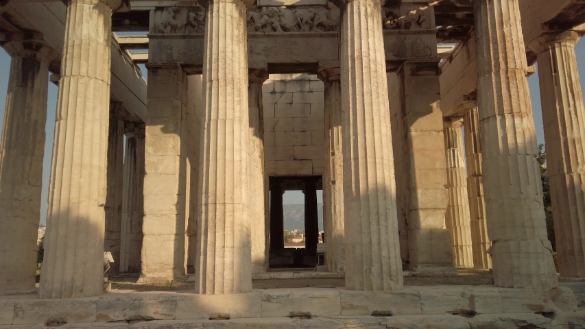 Amazing detailed tilt up view of the Temple of Hephaestus in ancient agora of Athens, Monastiraki district, Greece. The most well-preserved ancient Greek temple. POV from the base of the temple.