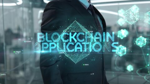 Blockchain Applications chosen by businessman in technology hologram concept