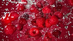 Super Slow Motion Shot of Flying and Splashing Fresh Raspberries on Red Gradient Background at 1000fps. - Powered by Shutterstock - Get 15% off with code: PIKWIZARD15