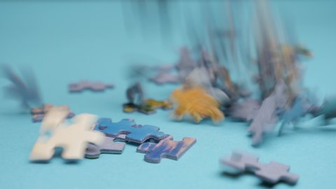 Puzzle pieces falling down. Business concept for key completion for business success. Falling down randomly puzzles fill blue background. Plan do check act