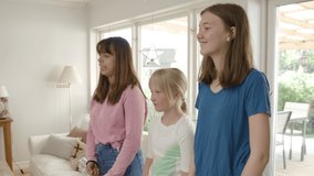 Three girls recording a dance video for a social media platform