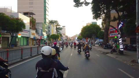 POV Traffic jam in Sai Gon, Ho Chi Minh city, Vietnam timelapse sunset after working hours, rush hour, footage of people, life, traffic, overpass bridge, sign, motor bike