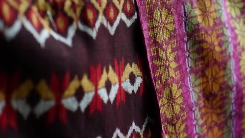 The traditional weaving fabric from Flores Island, Indonesia called "tenun ikat" (bunch technique). The coloring using natural dyes. 