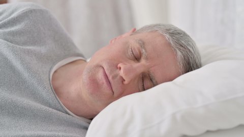 Close up of Old Man Sleeping in Bed 