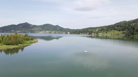4k drone Video over Colibita lake in the summer time, Romania.