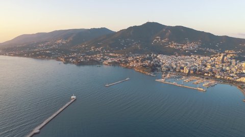 Majestic Scenery At Mytilene City In Lesvos Island, Greece With Boats And Yachts Moored On The Harbor In The Aegean Sea. - aerial drone shot