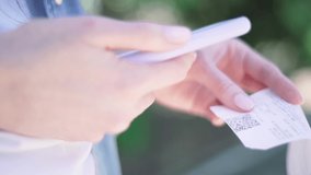 Qr Scan. Person scans qr code on a check from a smartphone, close-up. Financial accounting using a mobile app - Powered by Shutterstock - Get 15% off with code: PIKWIZARD15