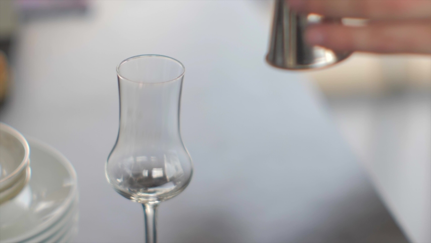 Whiskey in glasses on a thin leg. Cocktail party whiskey tasting. Day