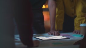 Group of Asia young creative people in smart casual wear discussing business brainstorming meeting ideas mobile application software design project in modern night office. Coworker teamwork concept. - Powered by Shutterstock - Get 15% off with code: PIKWIZARD15