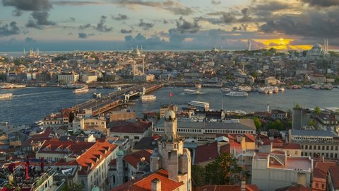 Istanbul, Turkey. Sunset view of Istanbul city center from Galata tower. Ferries sail along the Golden Horn Bay near the Galata Bridge