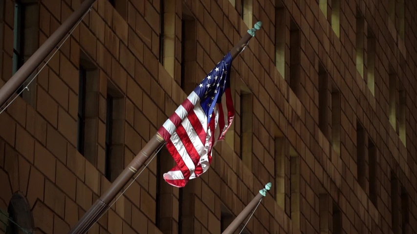 USA Flag in Slow Motion, waving in the wind at night. Slowly moving Flag