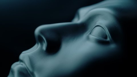 tear in slow motion on a mannequin face on a black background