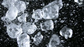 Super slow motion of ice cubes collision on black background. Filmed on high speed cinema camera, 1000 fps. - Powered by Shutterstock - Get 15% off with code: PIKWIZARD15
