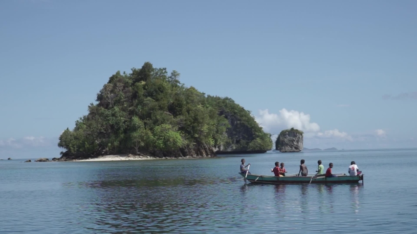 Raja Ampat Islands, West Papua, Indonesia - CIRCA 2020: Papuan People Papuans Melanesians Happy Cheerful Children on The Boat