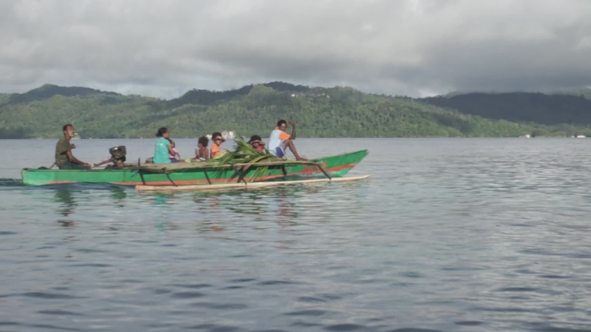 Raja Ampat Islands, West Papua, Indonesia - CIRCA 2020: Papuan People Papuans Melanesians On Boat