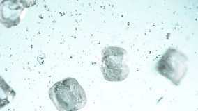 Super slow motion of ice cubes collision on blue background. Filmed on high speed cinema camera, 1000 fps. - Powered by Shutterstock - Get 15% off with code: PIKWIZARD15