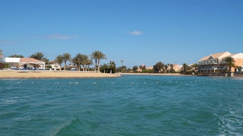 View from a floating ship. Buildings and beaches in El Gouna. El Gouna - a tourist resort on the Red Sea coast in Egypt