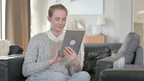 Cheerful Young Woman doing Video Call on Tablet at Home