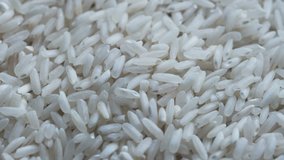 Grocery video background white polished rice close-up rotates in front of the camera macro shooting 