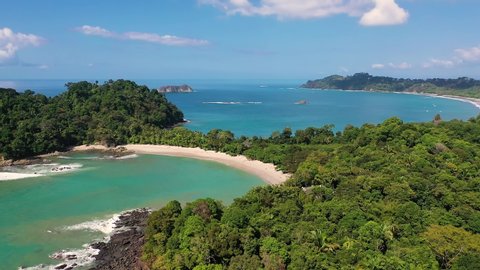 Flying above a beach located in the Manuel Antonio National Park, Costa Rica. 4K UHD video.