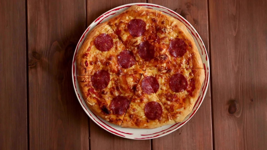 Close-up Of People from different cultures and different ages Hands Taking Slices of Pizza