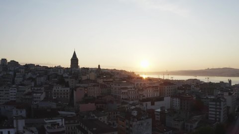 Aerial view sunrise of Galata Tower and Beyoglu. Empty Streets without people. Quarantine days. Istanbul Historical Peninsula Landscape. 4K Footage in Turkey
