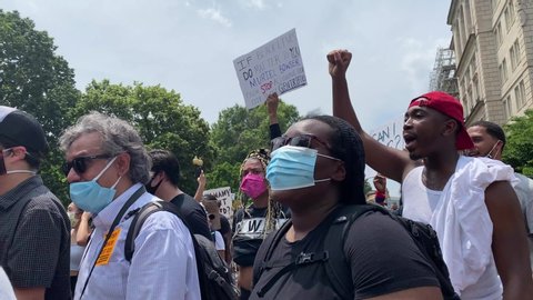 Washington, DC / USA - June 6, 2020: A George Floyd protest takes place outside of the White House. Thousands of people participate and stand up against systematic racism. 