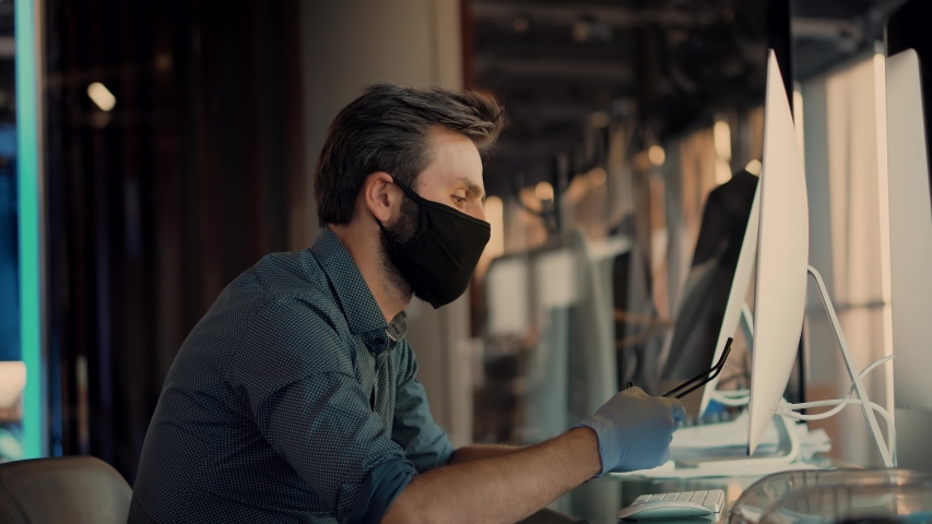 Businessman In Mask Protection Epidemic Coronavirus.Remote Working With Camera Chatting Colleagues Internet Online Meeting Conference Webinar.Man In Face Mask Working In Office.Distance Working Webcam | Shutterstock HD Video #1054265672