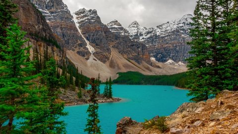 Banff National Park Most Visited Lake Moraine Lake Full View PAN UP The most famous and visited lake of Banff National Park outside of Lake Louis Deep Blue and teal green glacier silt Time Lapse 4k