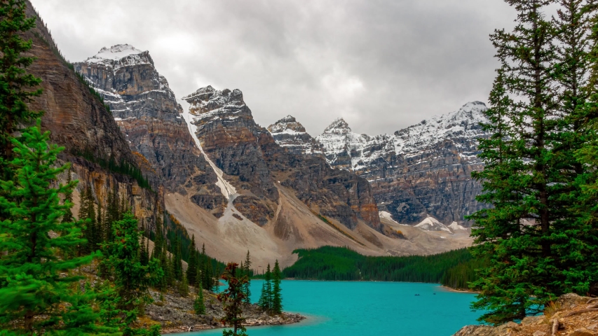 Banff National Park Most Visited Lake Moraine Lake Full View The most famous and visited lake of Banff National Park outside of Lake Louis Deep Blue and teal green glacier silt Time Lapse 4K Royalty-Free Stock Footage #1054268843