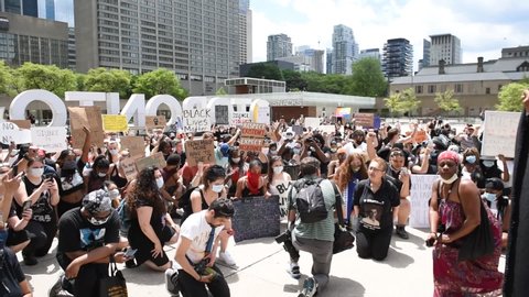 TORONTO, ONTARIO/CANADA – 6th Saturday June 2020 : Thousands of people took to Toronto streets in separate events to protest anti-black racism and police brutality on Saturday. in Toronto, Canada.