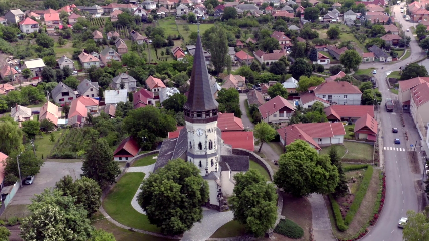 Aerial video baout the Church of the Assumption in Gyongyospata Hungary. Historical religious monument. Built in 12th century romanian baroque and gothic style. popular tourist attraction.